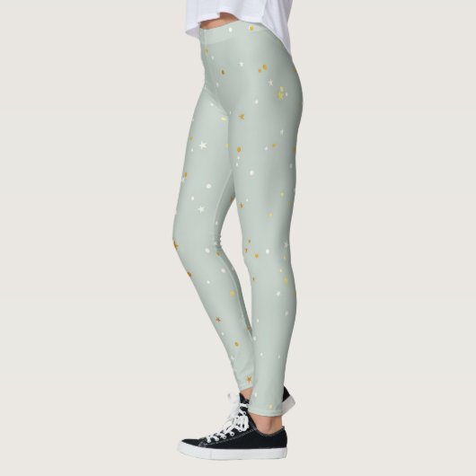 Leggings Monnaie Verte Avec Épercées Blanches Et Or (Gauche)