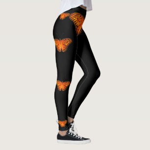Leggings Papillon orange hérissé sur fond noir