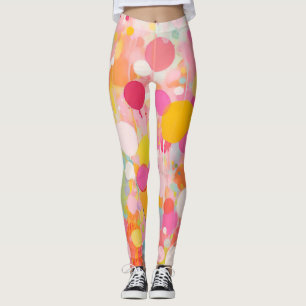 Leggings points colorés de peinture d'acryl sur un sol clai
