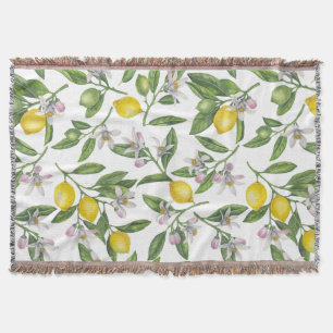Lemon branches with blossoms and fruit on white deken