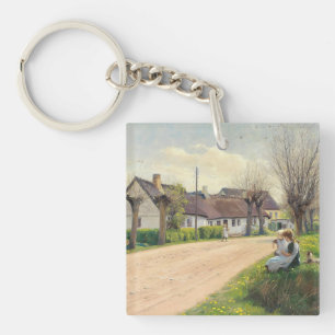Lente in het dorp met meisjes op de weg sleutelhanger