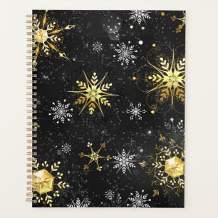 Les flocons dorés de Noël sur l'Arrière - plan noi