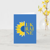 L'espoir s'épanouit au milieu de la carte de guerr (Fleur jaune)