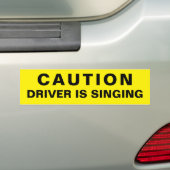 Let op de driver zingt bumpersticker (Op auto)