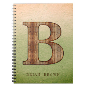Letter B-houtkorrel op groene beige grunge Notitieboek