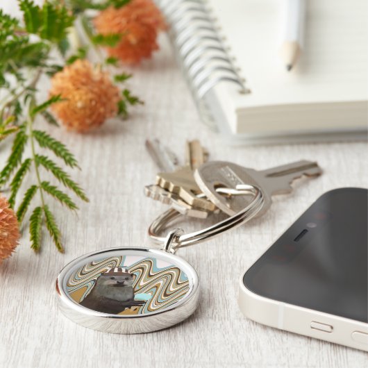 Leuke otter met ijs op wervelachtergrond sleutelhanger (Zijkant)