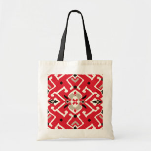Levendig ikat patroon in rood, wit en zwart tote bag