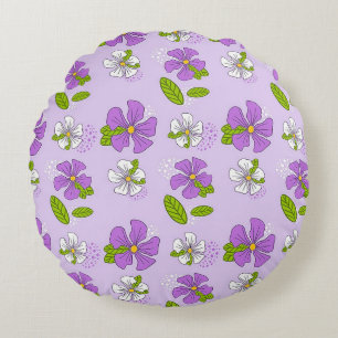 Levendige paarse en witte bloemen rond kussen