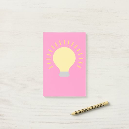 Levendige roze gele gloeilamp post-it® notes (Op bureau)