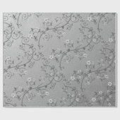 Liane florale blanche sur papier cadeau argenté (Plat)