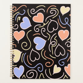 Lichtgekleurde harten op een zwarte achtergrond planner