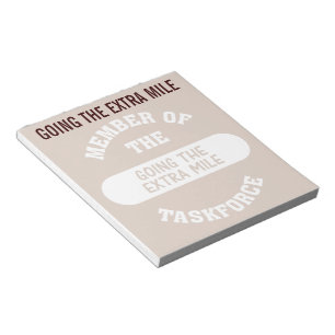 Lid van de Extra Mile Task Force Notitieblok
