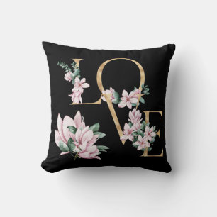 Liefde in gouden letters met magnoliumbloemen kussen