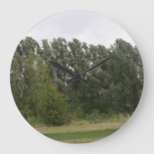 Lijn van hellende bomen landschap wandklok grote klok