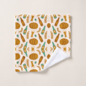 L'image présente un ensemble de serviettes et un g (Gant de toilette)