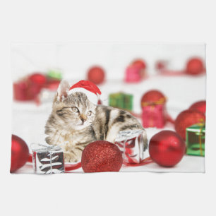Linge De Cuisine Chat portant un ornement de Noël au chapeau rouge