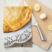 Linge De Cuisine Cheesecake on rustic wood cake top. (Quart Plié)