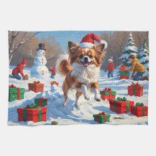 Linge De Cuisine Chien Papillon courant dans la neige avec un chape