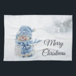 Linge De Cuisine Cute Snowman au photographe de Christmas<br><div class="desc">Une serviette de cuisine avec une jolie photo avec un petit bonhomme de neige. Debout dehors en hiver avec de la neige qui tombe tout autour. Ce mignon petit gars est habillé en vêtements de plein air tricotés bleus. Un peu de bokeh blanc/gris s'enflamme dans l'arrière - plan.</div>