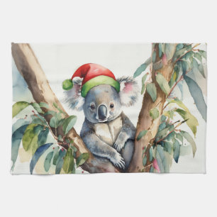 Linge De Cuisine Koala avec un chapeau de Père Noël assis dans un e