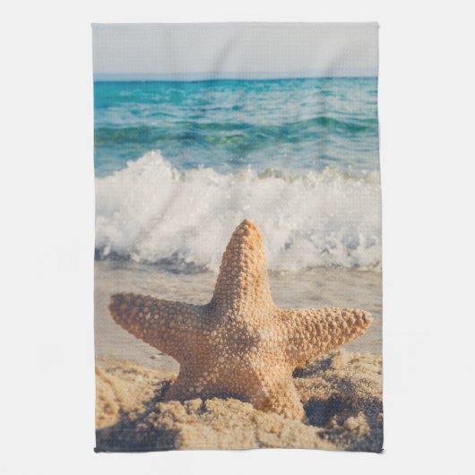 Linge De Cuisine Starfish sur une plage de sable Photo (Vertical)
