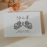 Livre d'or de mariage aux mains de squelette blanc