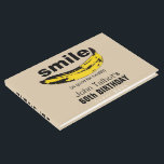 Livre D'or Smile est bon pour Health 60th Birthday Guest Book<br><div class="desc">Art graphique : Banane orientée pour former un sourire petit texte entre crochets : (est bon pour la santé). Parfait pour tous ceux qui continuent à sourire année après année. Conception du livre d'or à couverture rigide avec des textes pour la fête du 60e anniversaire à customiser. Vous pouvez facilement...</div>