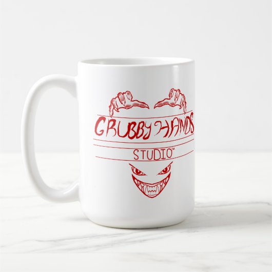 Logo Du Studio Grubby Hands + Mug De Devise (Gauche)