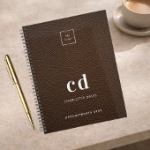 Logo van initialen van bruinledermonogram planner