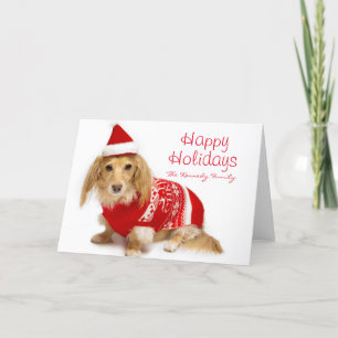 Longhaired tekkel die rode Kerstmis dragen Feestdagen Kaart