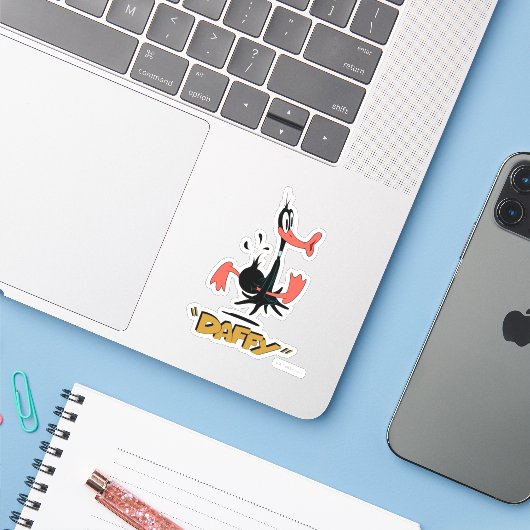 LOONEY TUNES™ Retro Laughs | DAFFY DUCK™ Sticker (Laptop met iPhone)