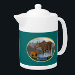 L'orignal dans le pré<br><div class="desc">Une mama orignal et son mignon veau avec un lac et des montagnes au loin. Le texte "Alaska" dans une police enneigée apparaît également. Vous pouvez choisir une autre couleur arrière - plan.</div>