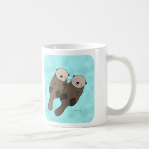 Loutre tenant la tasse mignonne de couples de