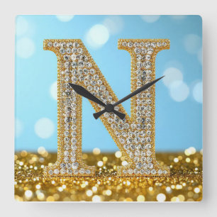 Luxe diamanten letter N op gouden glitter achtergr Vierkante Klok