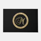M gouden monogram op zwart deurmat (Voorkant)