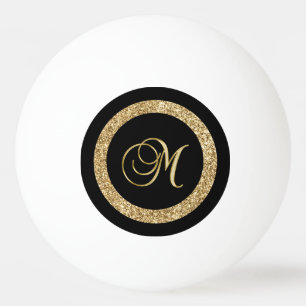 M gouden monogram op zwart pingpongballen
