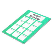 Maandelijks projectschema groene ruwe druk notitieblok (Schuin)