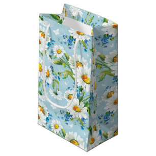 Madeliefje op blauwe cadeautas