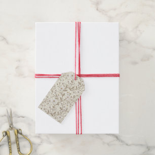 Madeliefjes in wit en bruin op gebroken wit cadeaulabel