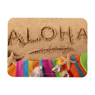 Magnet Flexible Le mot Aloha écrit sur une plage sablonneuse, ave