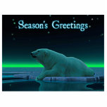 Magnet Photo Sculpture Bonnes Fêtes - Ours polaire en bordure de glace<br><div class="desc">Un moment de paix dans la longue nuit arctique. Un Ours polaire repose au bord d'une zone ouverte dans la glace de la meute. Les aurores boréales brillent au loin ; les étoiles brillantes scintillent au-dessus. "Bonnes Fêtes" apparaît en bleu et blanc éclatant. Ajoutez votre propre texte. Les ours polaires...</div>
