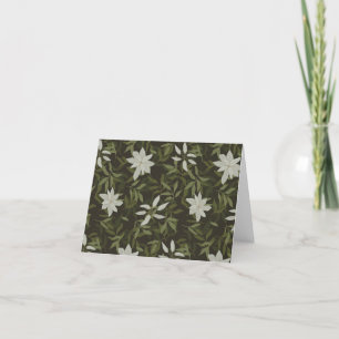 Magnolia en groen blad op zwart bedankkaart