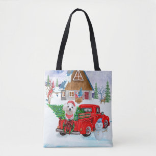 Maltese hond in kerstcadeauwagen draagtas