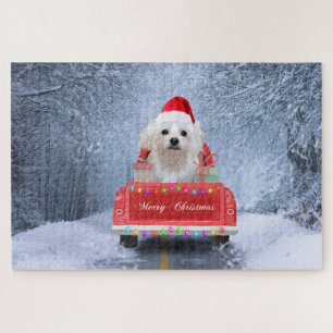 Maltezer hond in de sneeuw zittend in Kersttruck  Legpuzzel