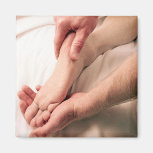 Man Massaging Male Foot Magneet