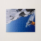 Man op een snowboard die van een kraanhuis springt legpuzzel (Horizontaal)