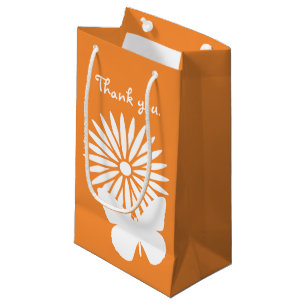 Marguerites et papillons dans le sac cadeau Orange