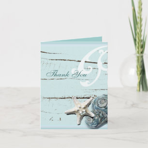 Mariage sur la plage aux coquillages bleus merci