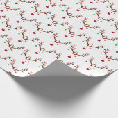 Matig rood geknoeid rendierlijk licht cadeaupapier (Hoek)