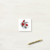 Mechanische haling met rode rozen post-it® notes (Op bureau)